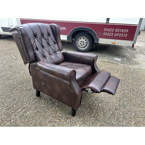 193 - A brown chesterfield leather reclining armchair