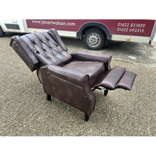 193 - A brown chesterfield leather reclining armchair