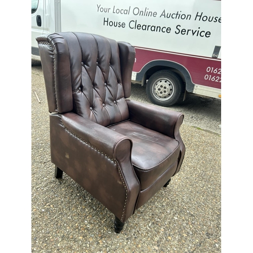 193 - A brown chesterfield leather reclining armchair