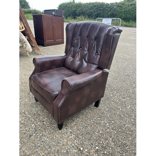 193 - A brown chesterfield leather reclining armchair