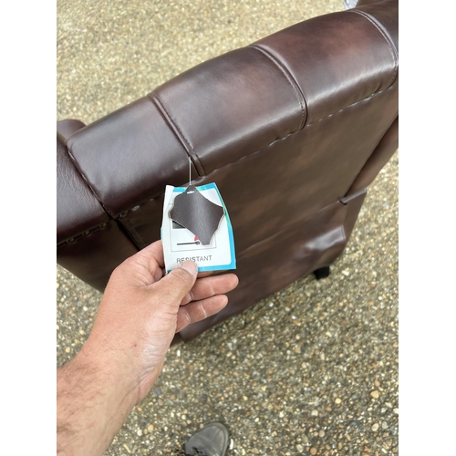 193 - A brown chesterfield leather reclining armchair