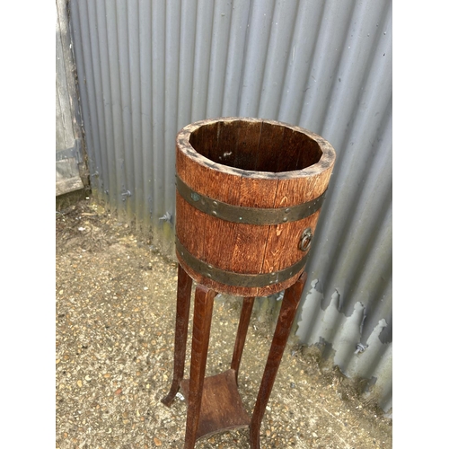 198 - A brass banded oak plant stand 96 cm tall