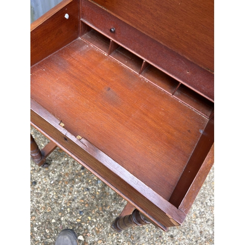 2 - An Edwardian mahogany Davenport desk with four drawers and four dummy drawers