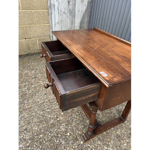 221 - An oak linenfold two drawer table 90x50 x74