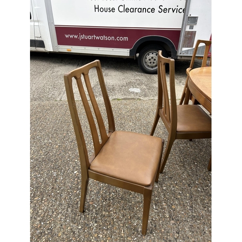 227 - A Mid century Nathan teak extending table with six matching chairs 229x99