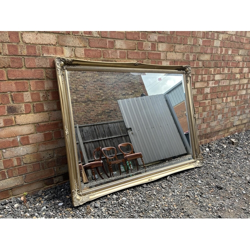 363 - A very large gold gilt framed  overmantle mirror 140x110