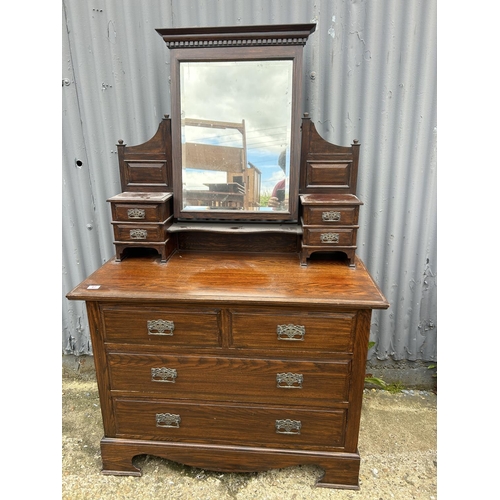 67 - A oak dressing chest of four drawers