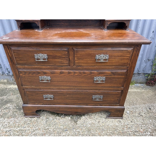 67 - A oak dressing chest of four drawers