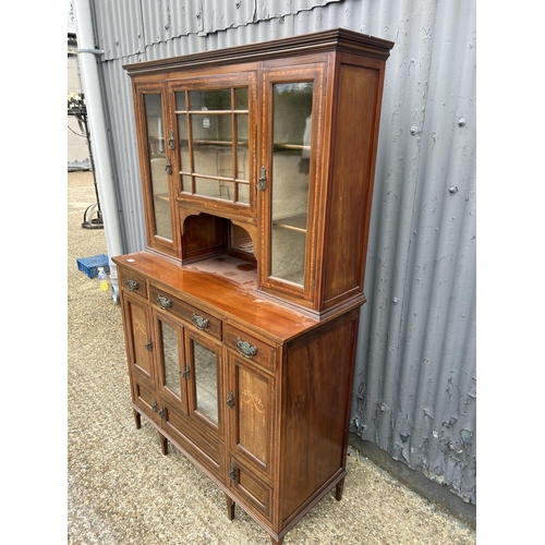 68 - An Edwardian mahogany inlaid cabinet with glazed top over three drawer and cabinet base 106x44x173