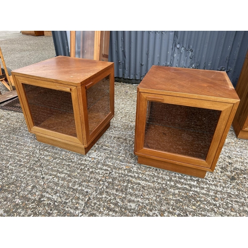 76 - A good quality danish teak multi sectional lounge unit with glazed tops over sideboard and glazed cu... 