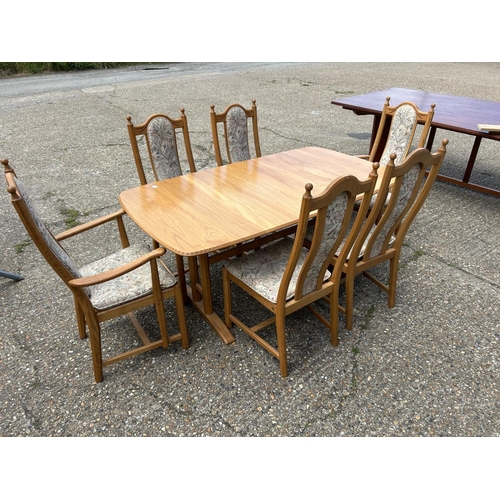 81 - A modern ercol light elm extending dining table with six chairs 162x90x 75