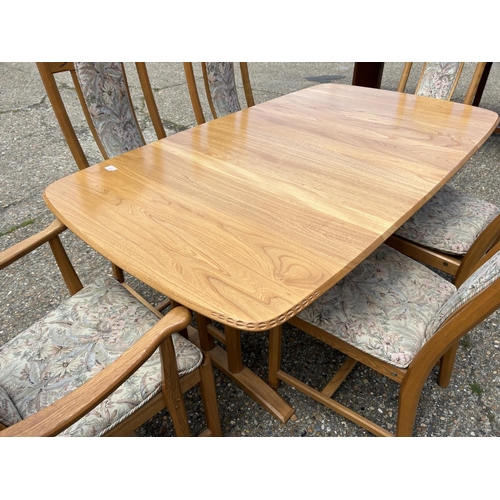 81 - A modern ercol light elm extending dining table with six chairs 162x90x 75