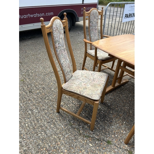 81 - A modern ercol light elm extending dining table with six chairs 162x90x 75