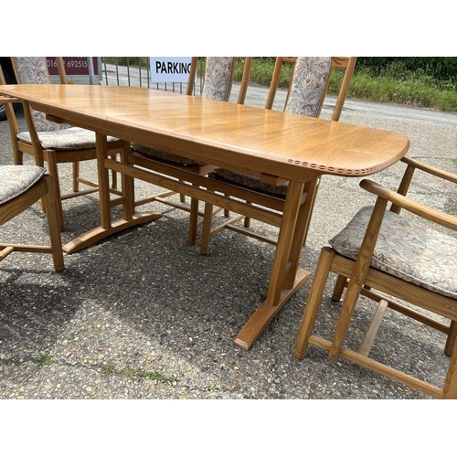 81 - A modern ercol light elm extending dining table with six chairs 162x90x 75