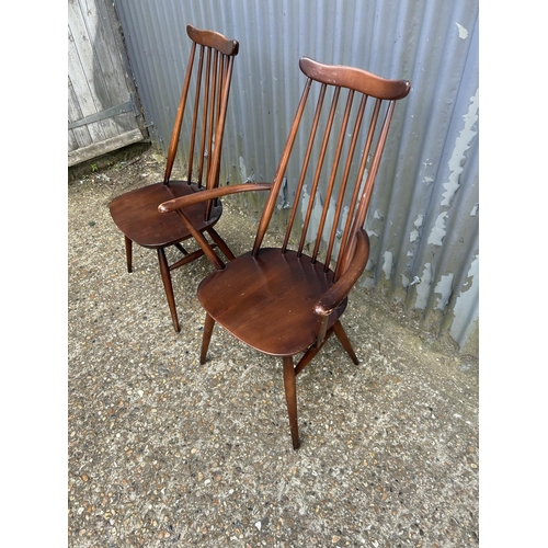 87 - Two dark ercol stick back chairs