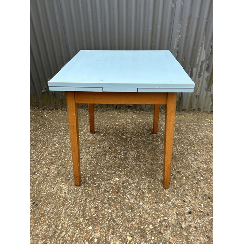 90 - A blue formica kitchen table 74x75