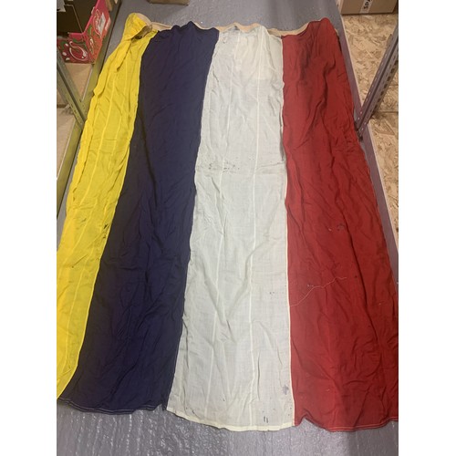 1048 - Large yellow, blue, white and red striped flag approx 220 x 150 cms, some moth hole damage