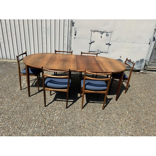 155 - A danish rosewood extending dining table by ROSENGREN HANSEN together with a set of six matching ros... 