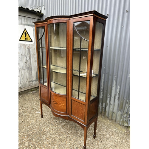 159 - An Edwardian inlaid mahogany display display cabinet with bow glass front 130x30x180