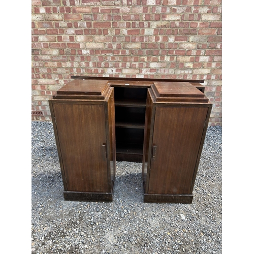 10 - A deco bookcase flanked with a single door  cupboard to each end (separates)