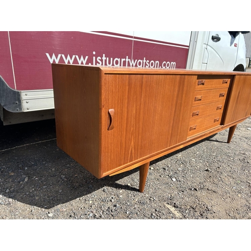 100 - A danish teak sidebaord by DANSK with removable two section cabinet top