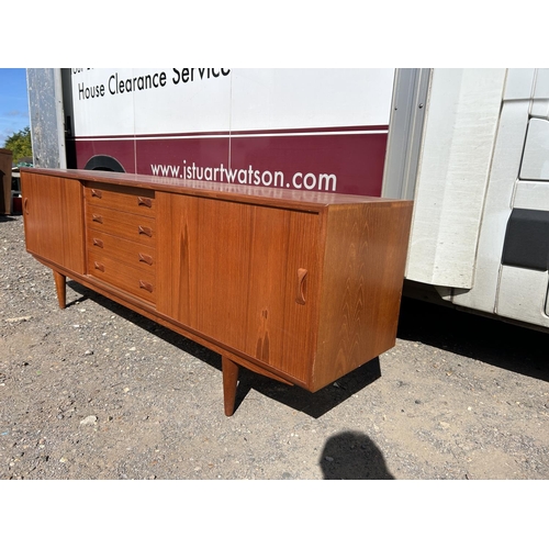 100 - A danish teak sidebaord by DANSK with removable two section cabinet top