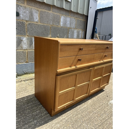 107 - A Nathan teak four drawer sideboard 103x45 x75