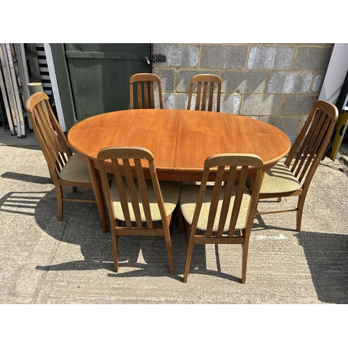 109 - A teak extending dining tabke and six chairs 150x90