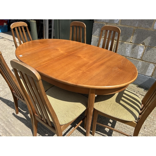 109 - A teak extending dining tabke and six chairs 150x90