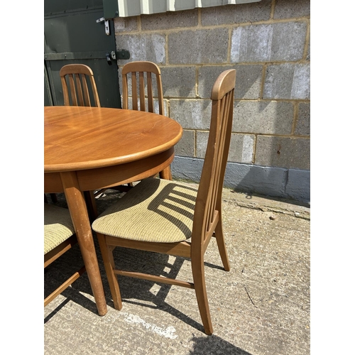 109 - A teak extending dining tabke and six chairs 150x90