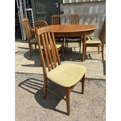 109 - A teak extending dining tabke and six chairs 150x90