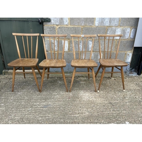 115 - A set of four ercol stick back chairs