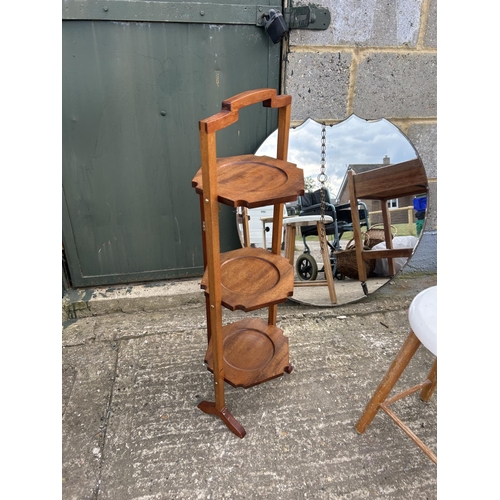 116 - An oak trolley, frameless mirror, cake stand and stool