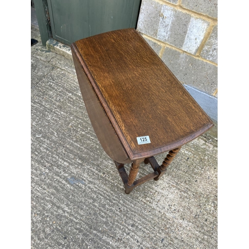 125 - An oak barley twist gateleg table