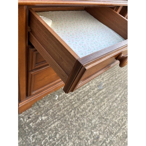 126 - A pair of hardwood three drawer bedsides