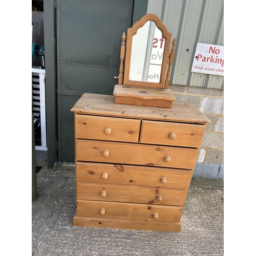 128 - A solid pine chest of six drawers together with pine swing mirror 100x46x115