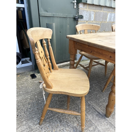 129 - A farmhouse style pine table fitted with drawer together with six pine chairs 184x86x77