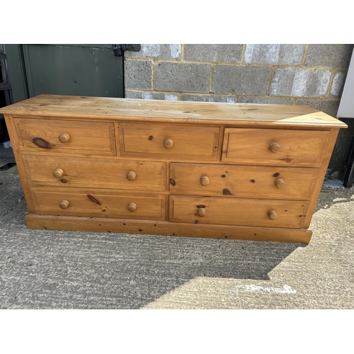 136 - A pine lowboy chest of seven drawers 170x43x77