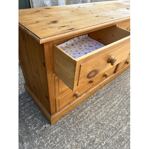 136 - A pine lowboy chest of seven drawers 170x43x77