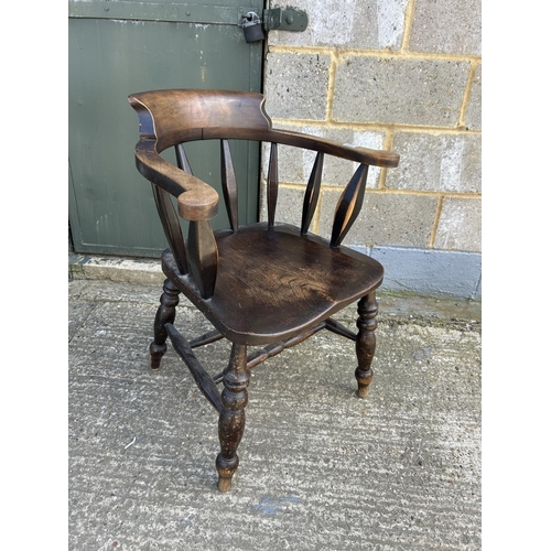 137 - A smokers bow back desk chair