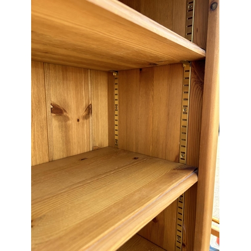 142 - A pine open fromted bookcase 91x35x199