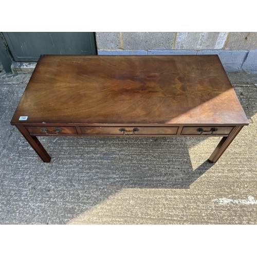 144 - A reproduction mahogany three drawer coffee table 120x60x 47