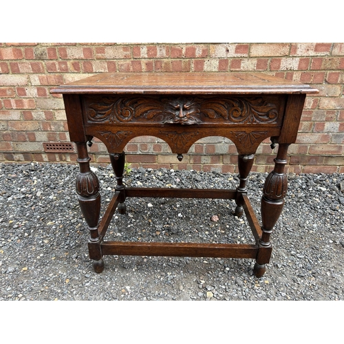 16 - A carved oak side table 76x52 x74