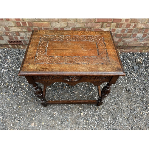 16 - A carved oak side table 76x52 x74