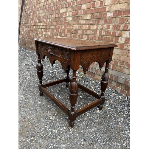 16 - A carved oak side table 76x52 x74