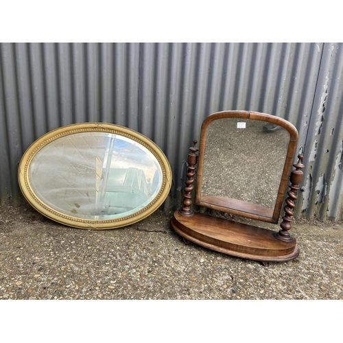 160g - A  mahogany swing mirror together with a gold gilt oval mirror