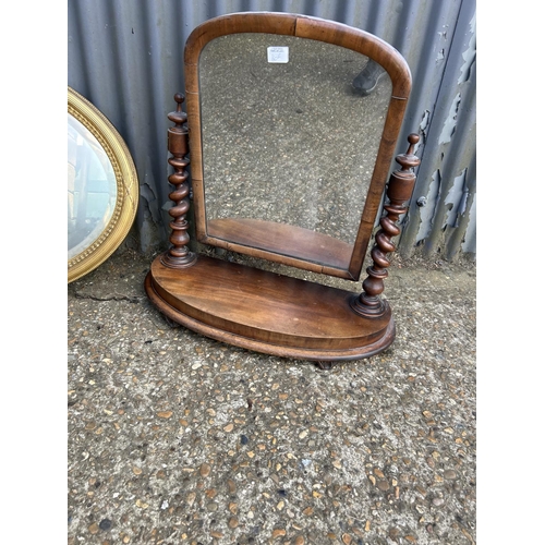 160g - A  mahogany swing mirror together with a gold gilt oval mirror