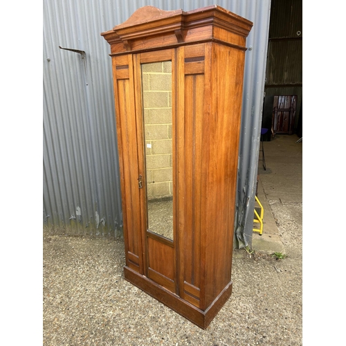 160h - An Edwardian satinwood single door wardrobe 82x40x210