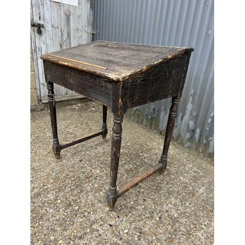 203 - An antique pine teachers desk with lift up top 87x66x100