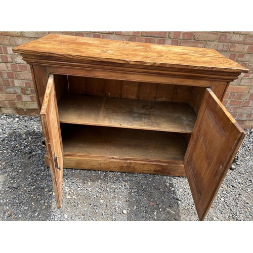 24 - A pine two door larder cupboard / sideboard   124x55x76